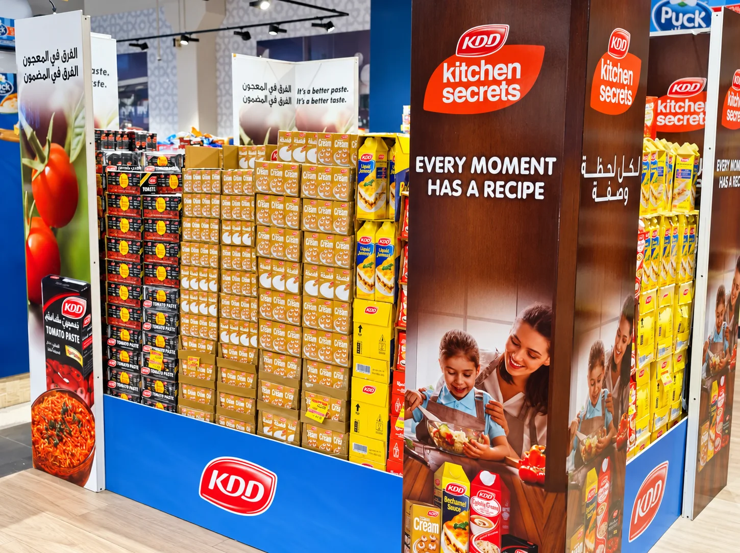 KDD kitchen products arranged in a branded retail promotional display